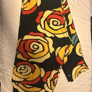 One size lularoe beauty and the beast rose leggings. Disney